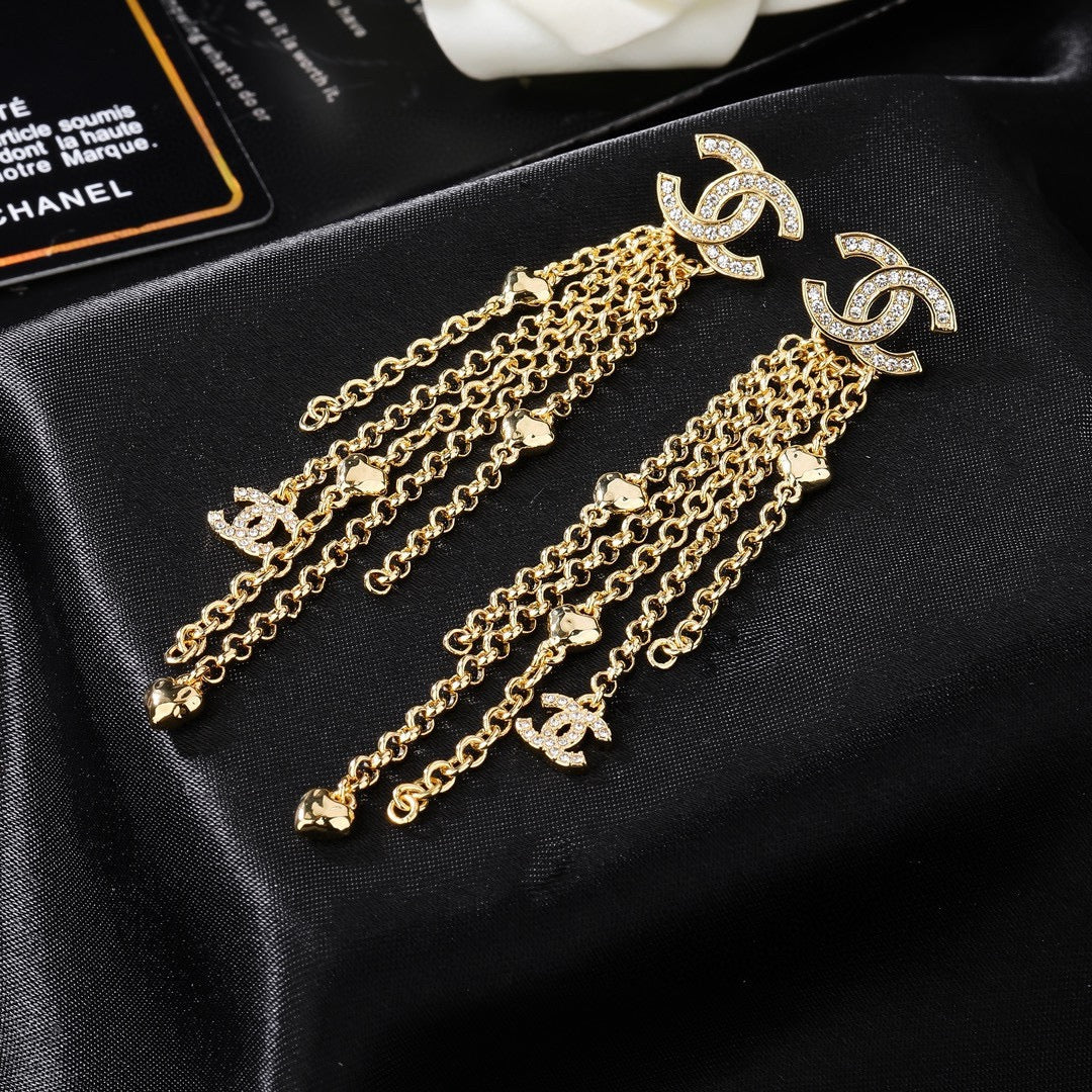 Martin Graham earrings in polished metal-tone – close-up detail