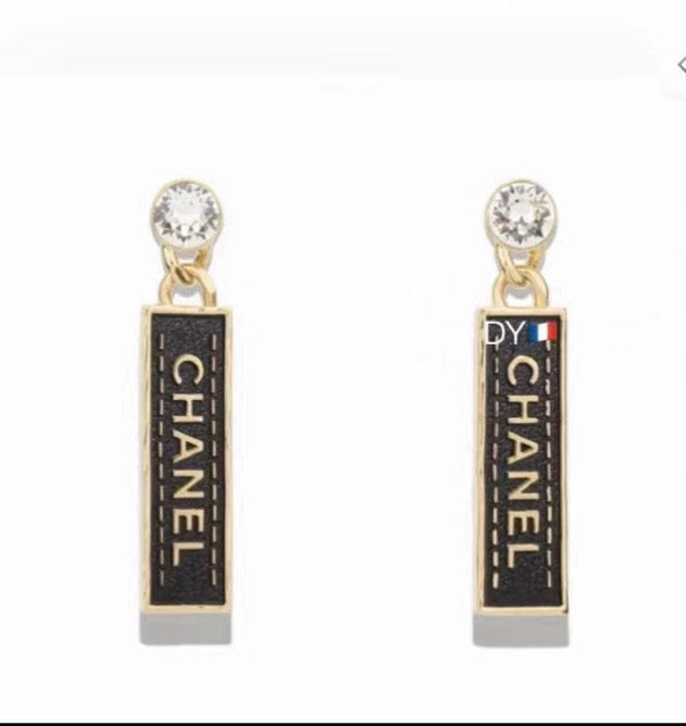 Martin Graham earrings in polished metal-tone – close-up detail