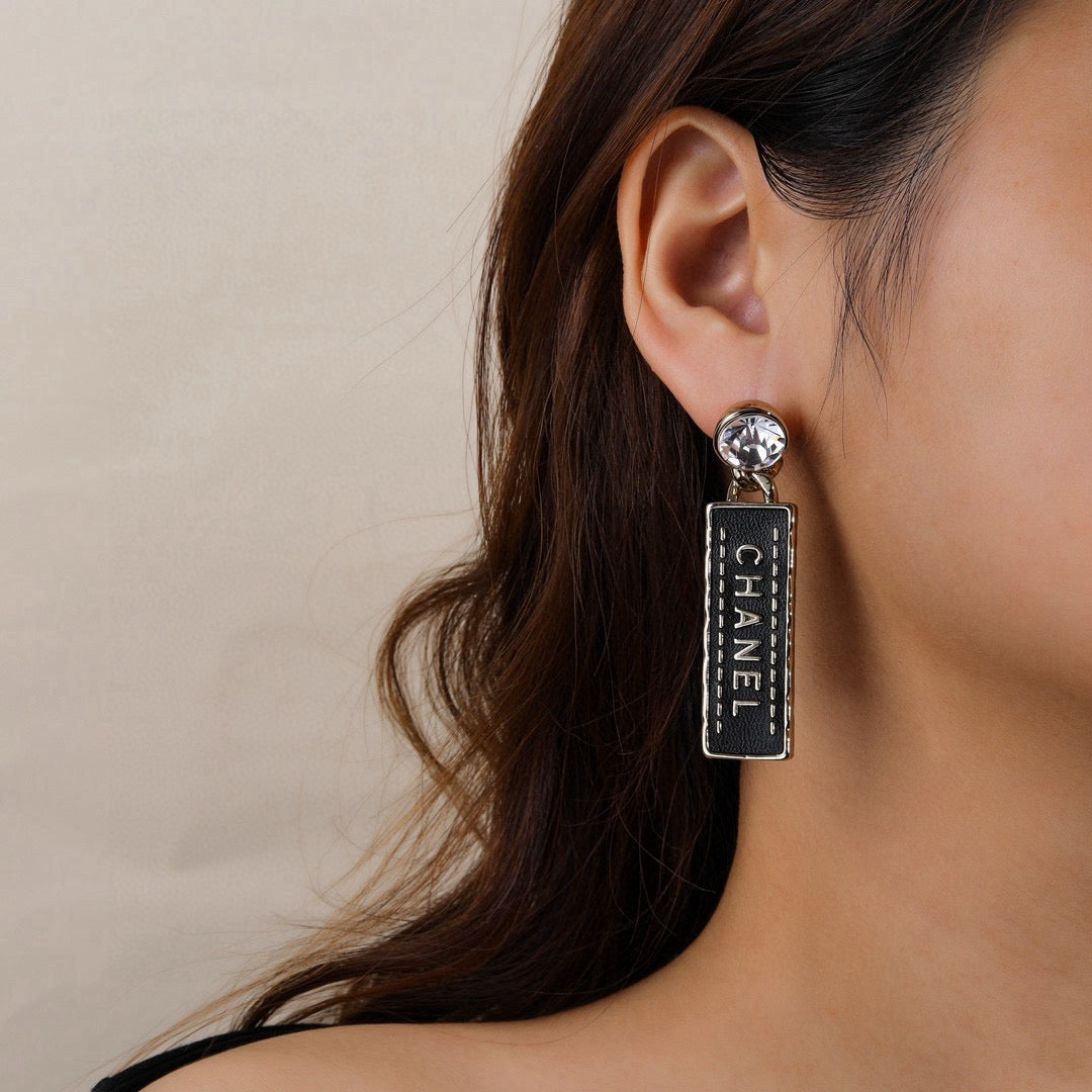 Martin Graham earrings in polished metal-tone – front product view