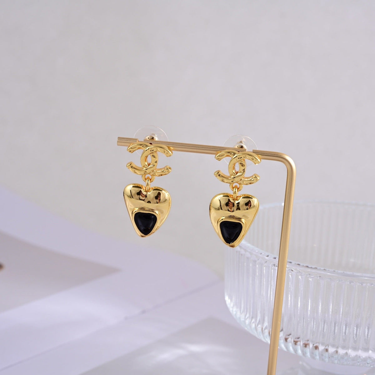 Martin Graham stud earrings in polished metal-tone – side detail