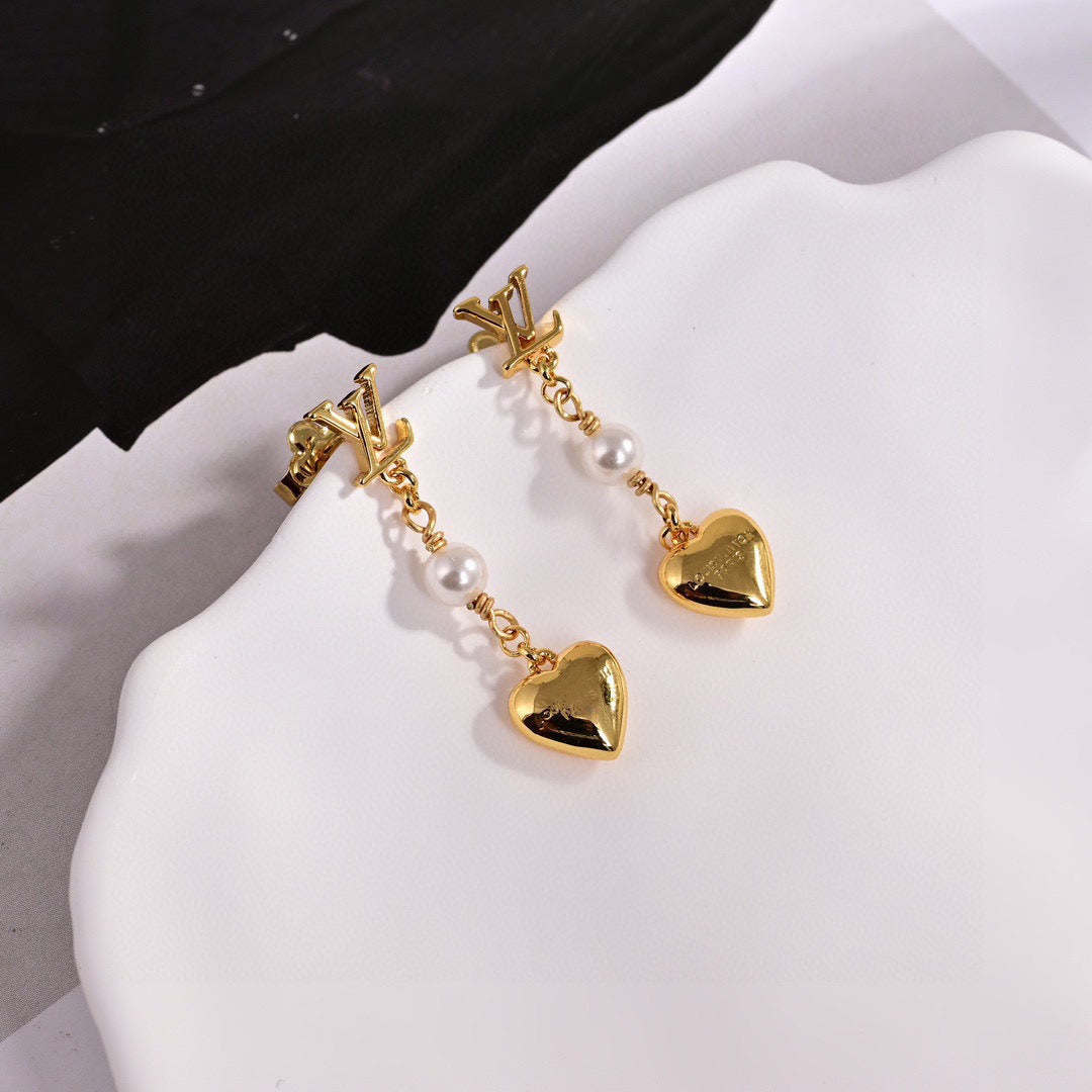 Martin Graham stud earrings in polished metal-tone – side detail