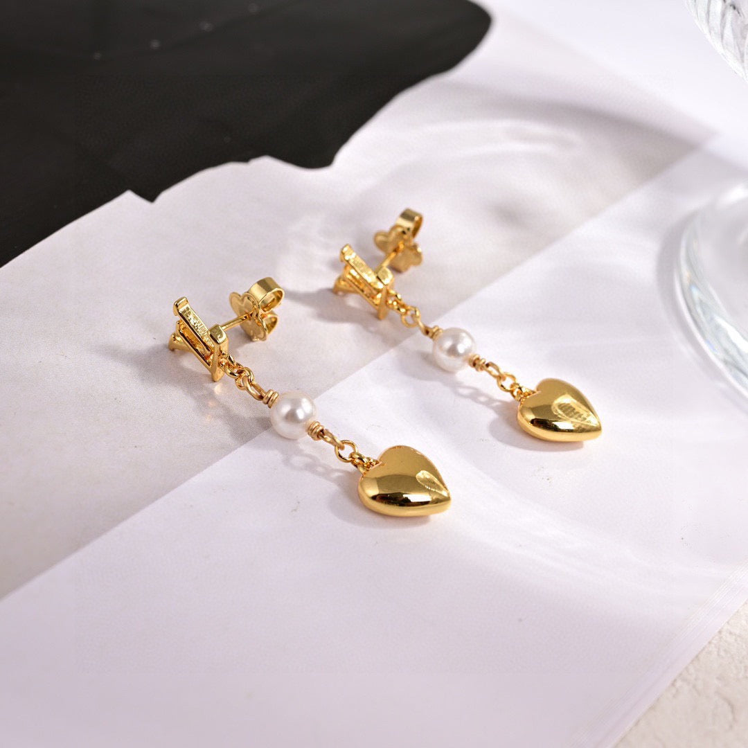 Martin Graham stud earrings in polished metal-tone – styled product view