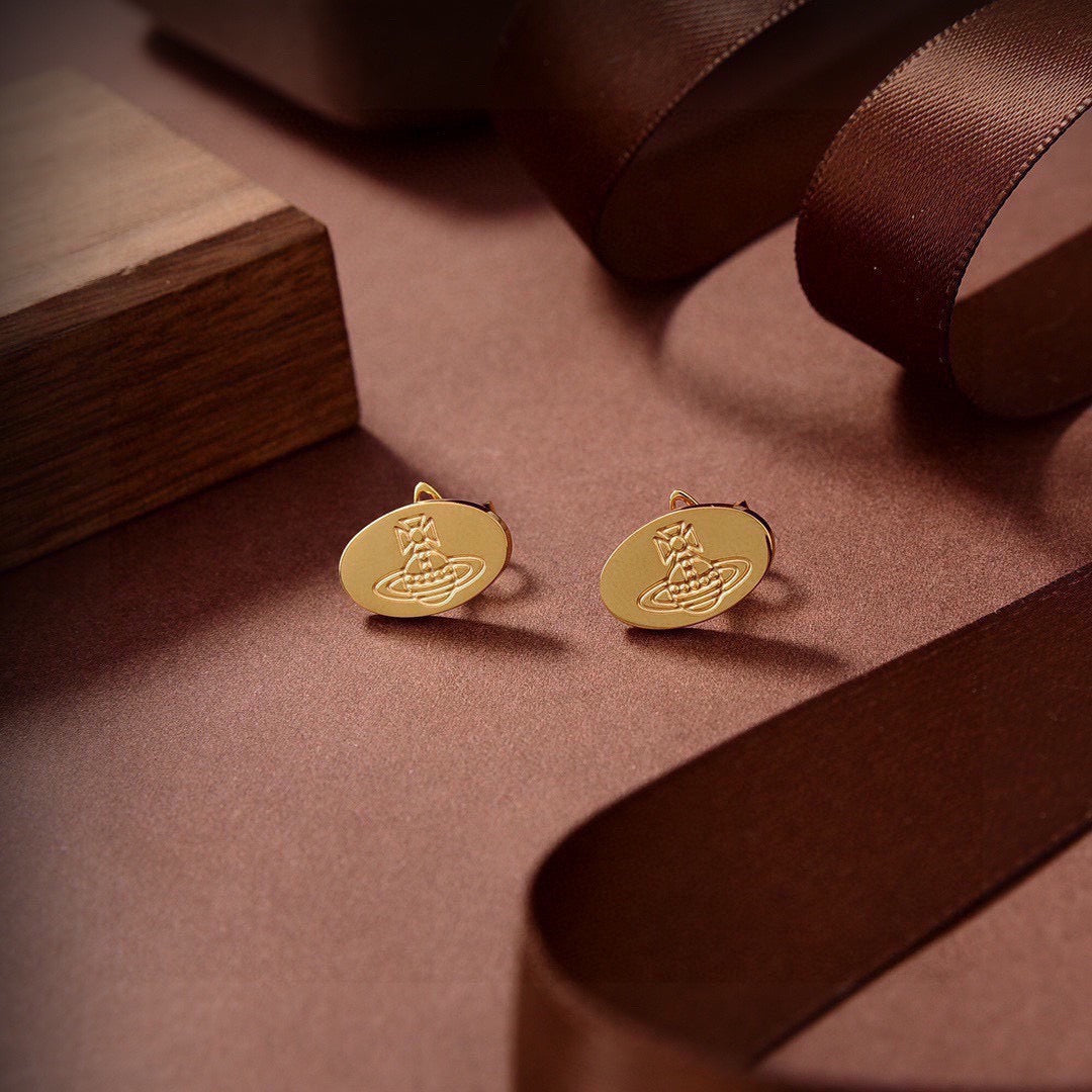 Martin Graham stud earrings in polished metal-tone – styled product view