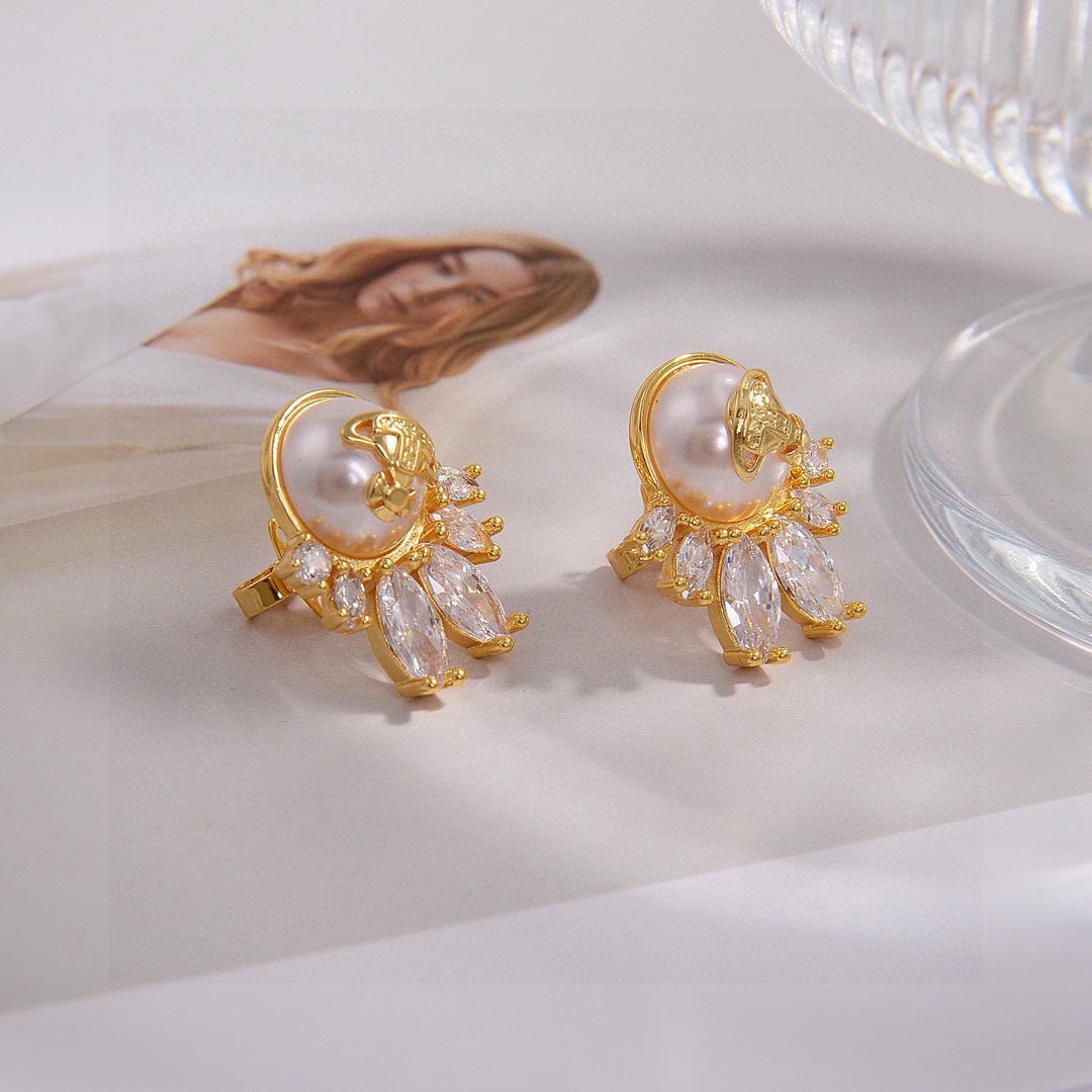 Martin Graham stud earrings in polished metal-tone – close-up detail