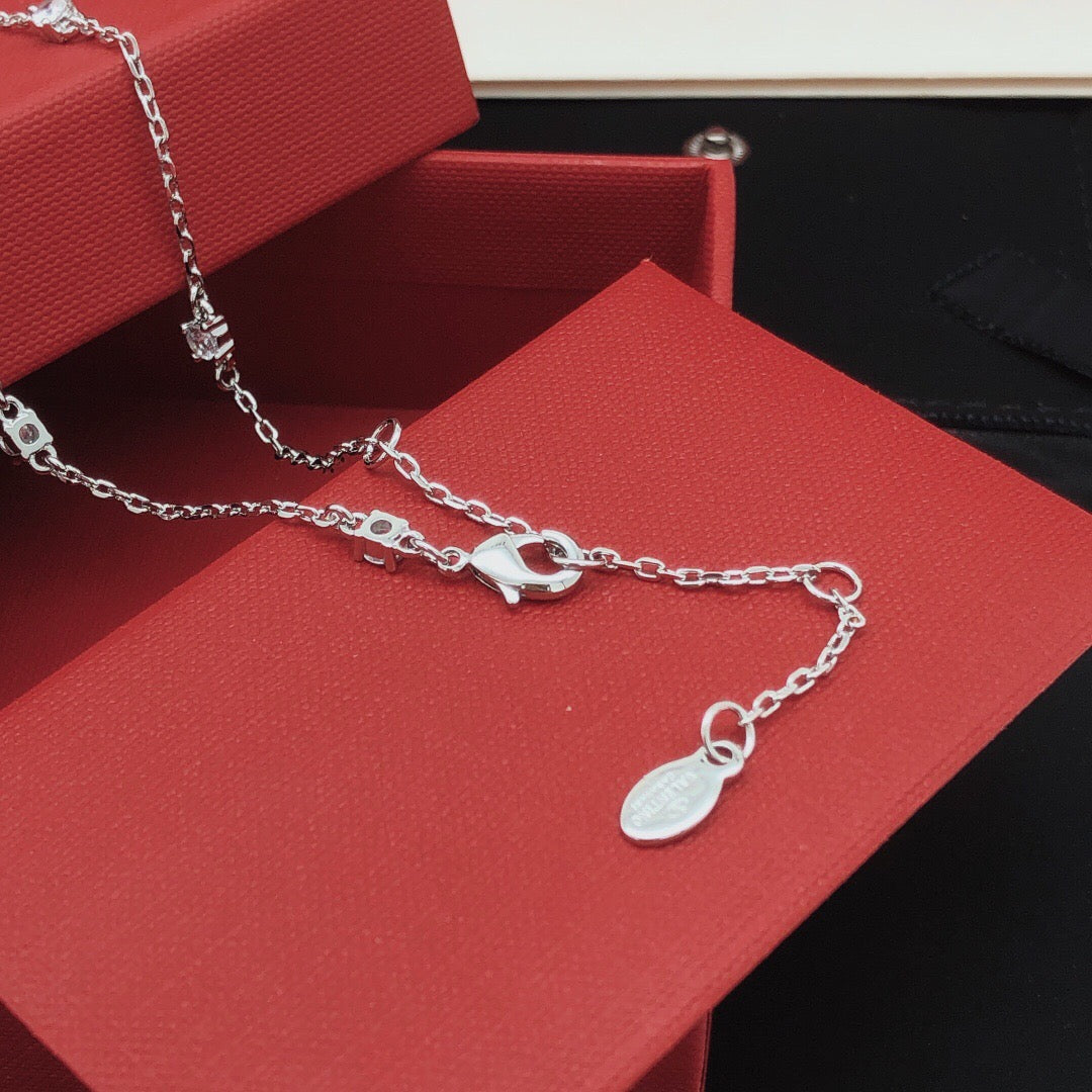 Martin Graham pendant necklace in polished metal-tone – front view