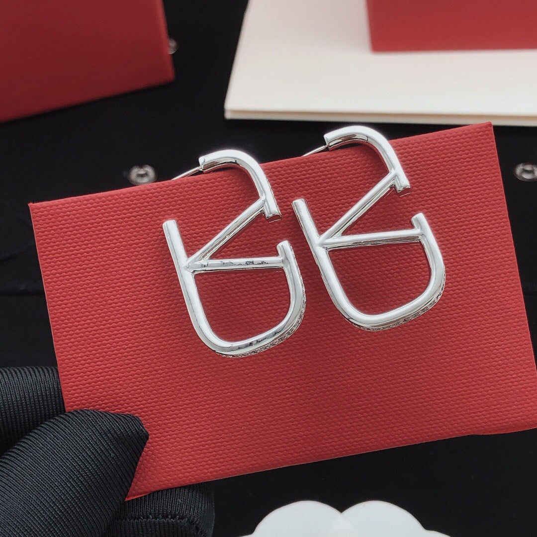 Martin Graham stud earrings in polished metal-tone – main product view