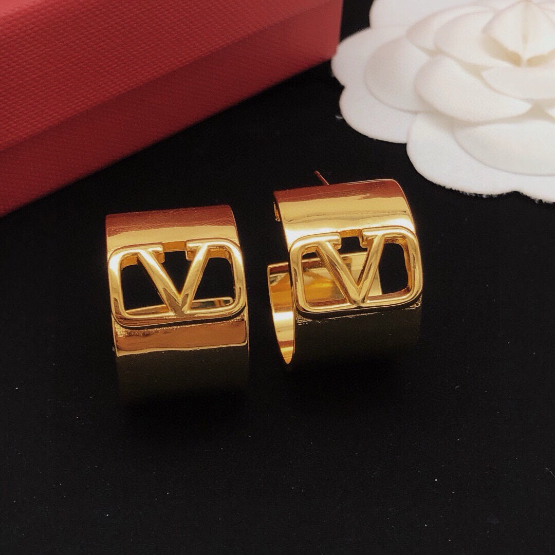 Martin Graham earrings in polished metal-tone