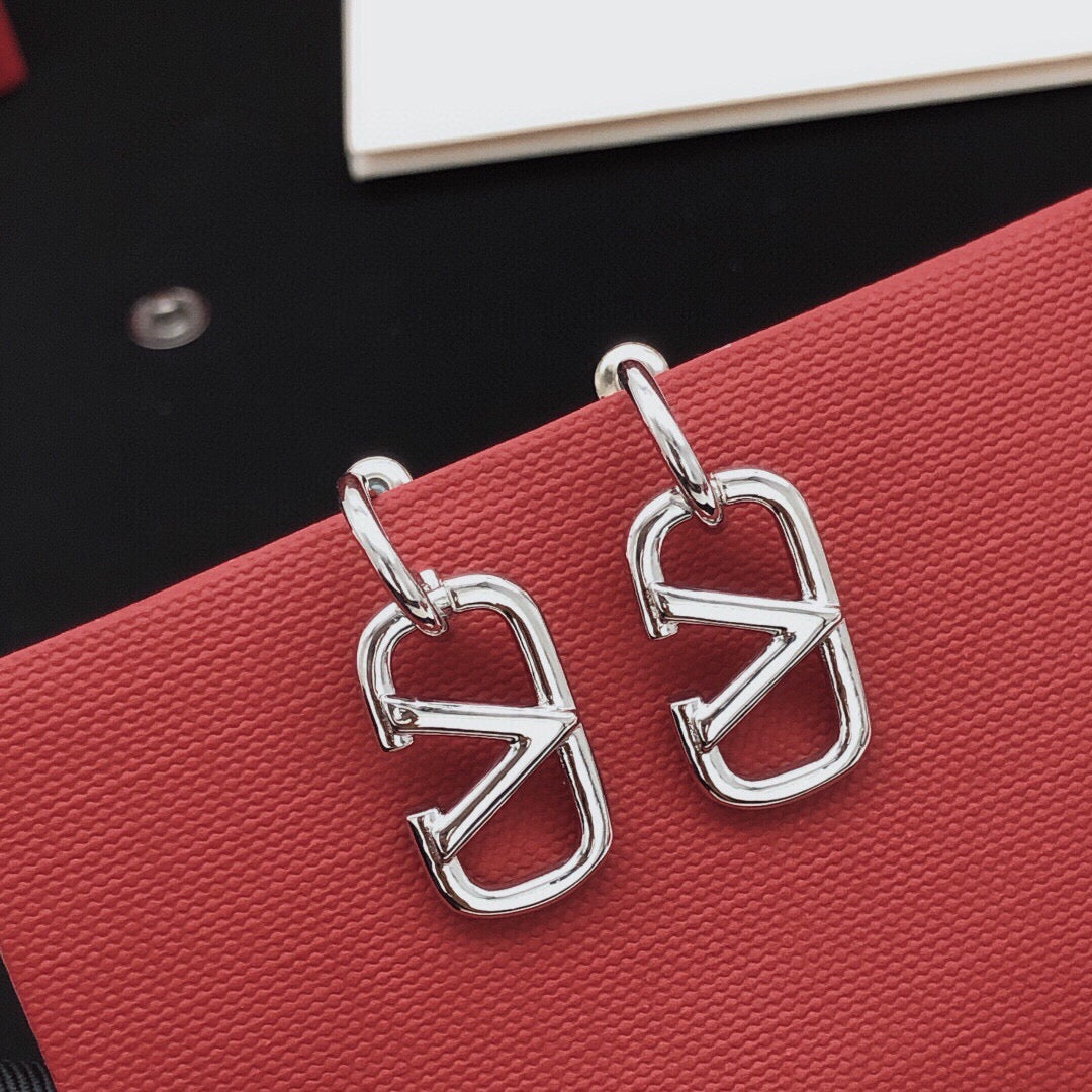 Martin Graham drop earrings in polished metal-tone – side detail