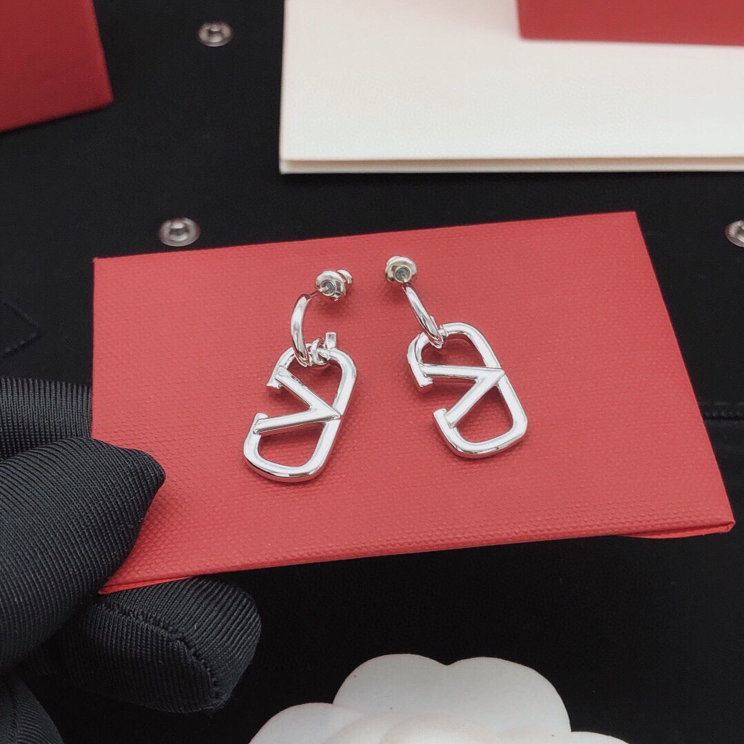 Martin Graham drop earrings in polished metal-tone – detail view