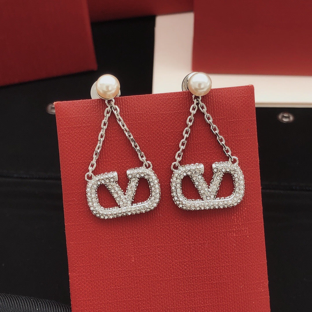 Martin Graham stud earrings in polished metal-tone – front view