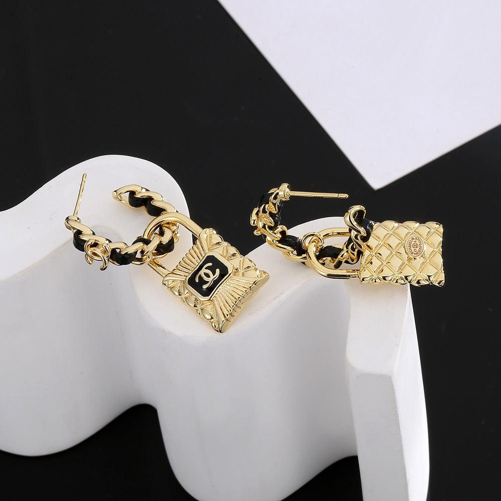Martin Graham stud earrings in polished metal-tone – styled product view