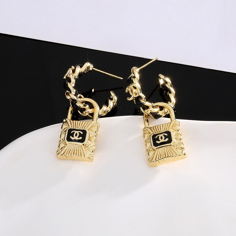 Martin Graham stud earrings in polished metal-tone – detail view
