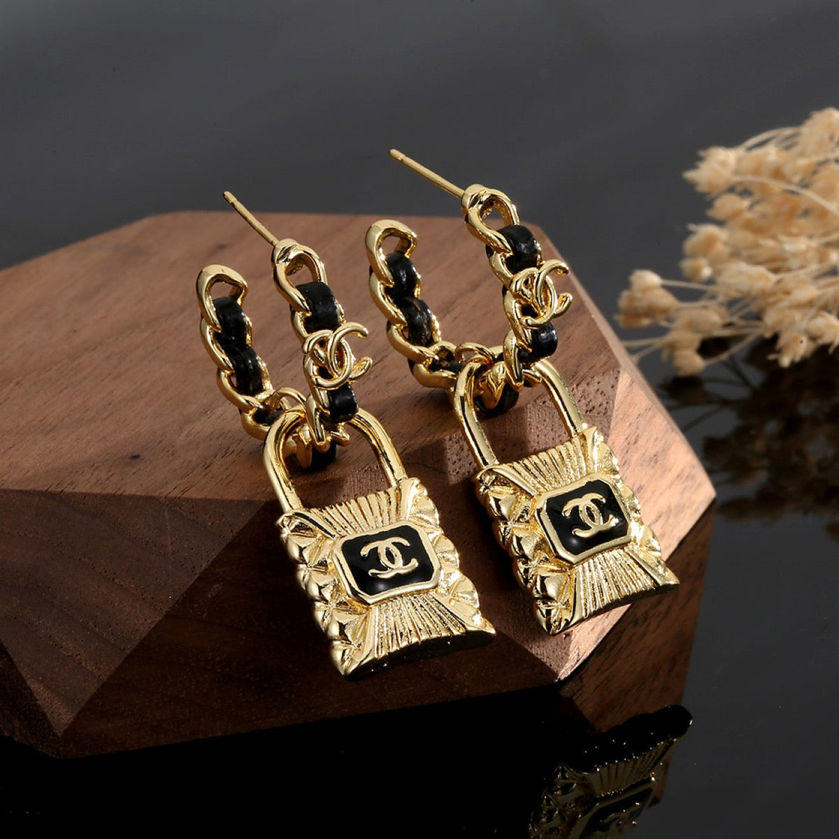 Martin Graham stud earrings in polished metal-tone – close-up detail
