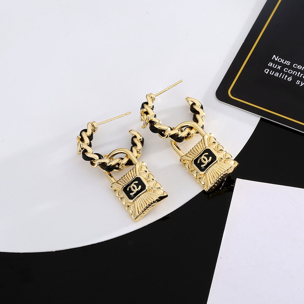 Martin Graham stud earrings in polished metal-tone – front product view