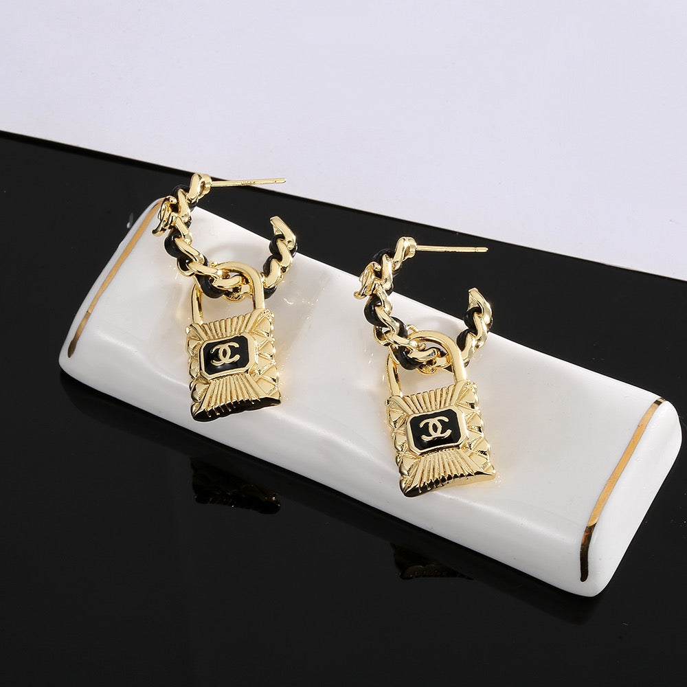 Martin Graham stud earrings in polished metal-tone – side detail