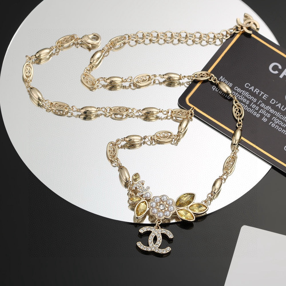 Martin Graham pendant necklace in polished metal-tone – side detail