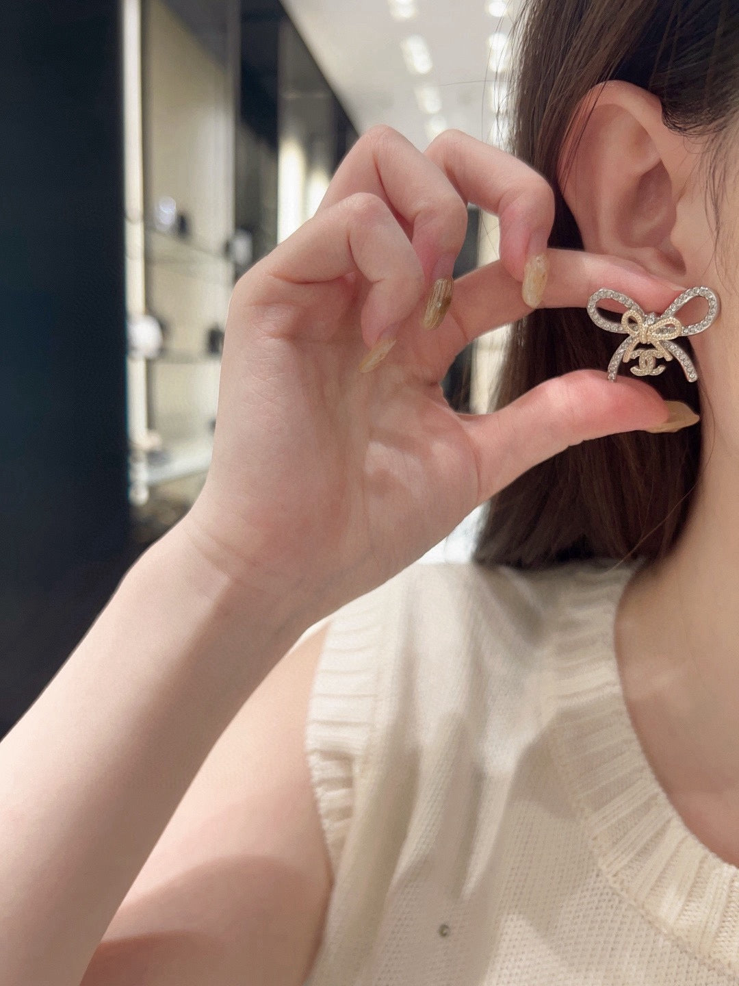 Martin Graham stud earrings in polished metal-tone – detail view
