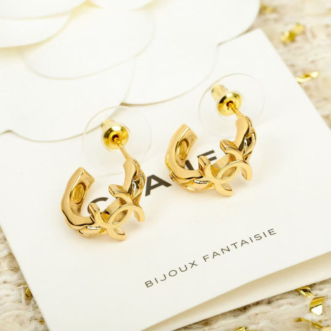 Martin Graham stud earrings in polished metal-tone – styled product view