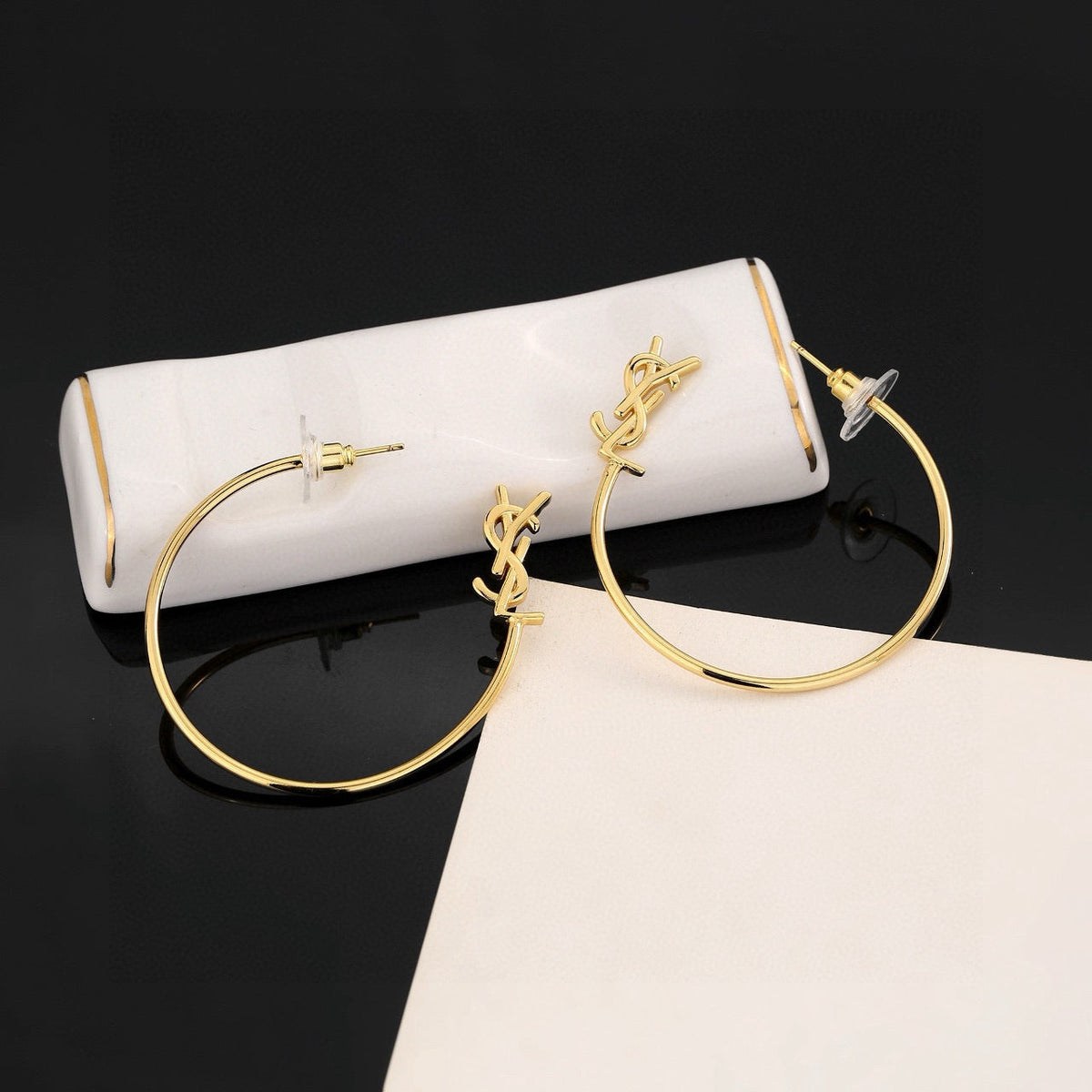 Martin Graham stud earrings in polished metal-tone – styled product view