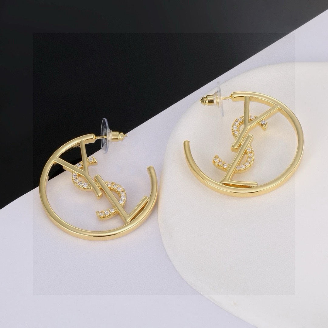 Martin Graham stud earrings in polished metal-tone – close-up detail
