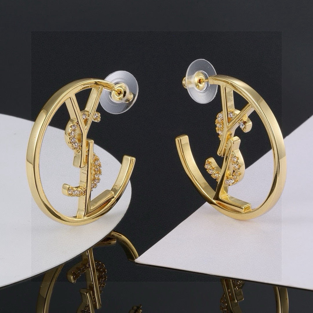 Martin Graham stud earrings in polished metal-tone – detail view