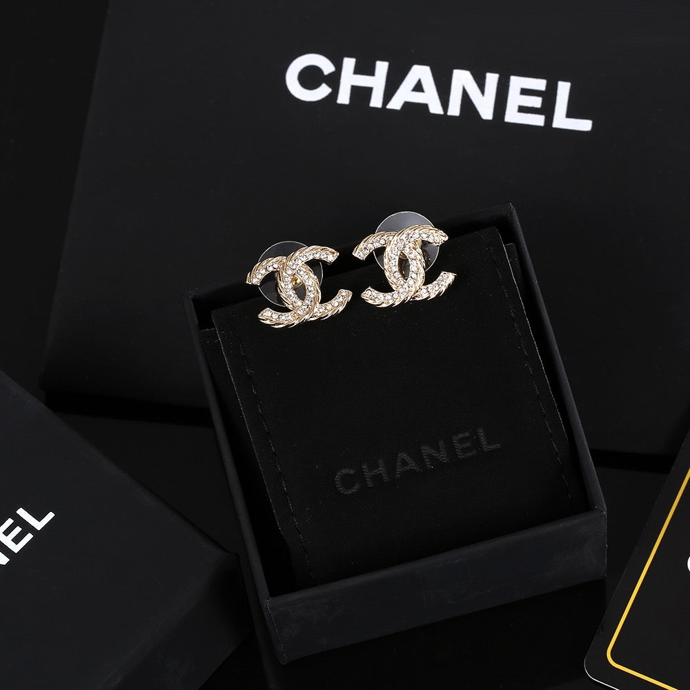 Martin Graham stud earrings in polished metal-tone – front product view