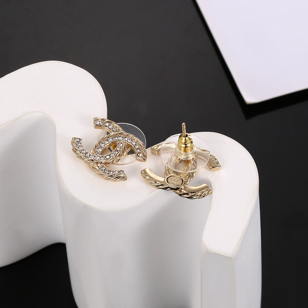 Martin Graham stud earrings in polished metal-tone – main product view