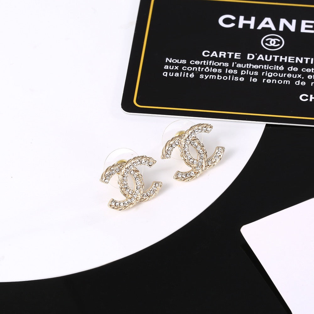 Martin Graham stud earrings in polished metal-tone – detail view