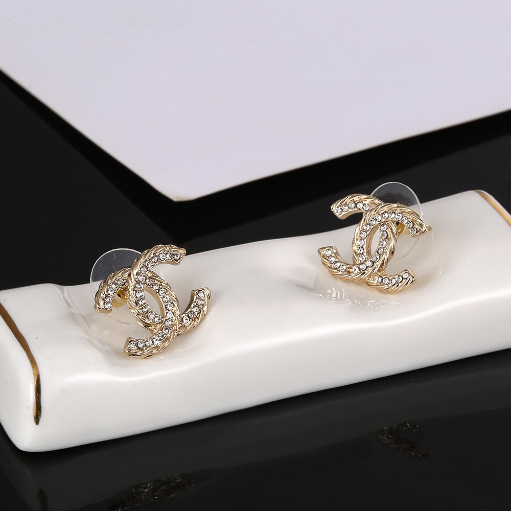 Martin Graham stud earrings in polished metal-tone – side detail