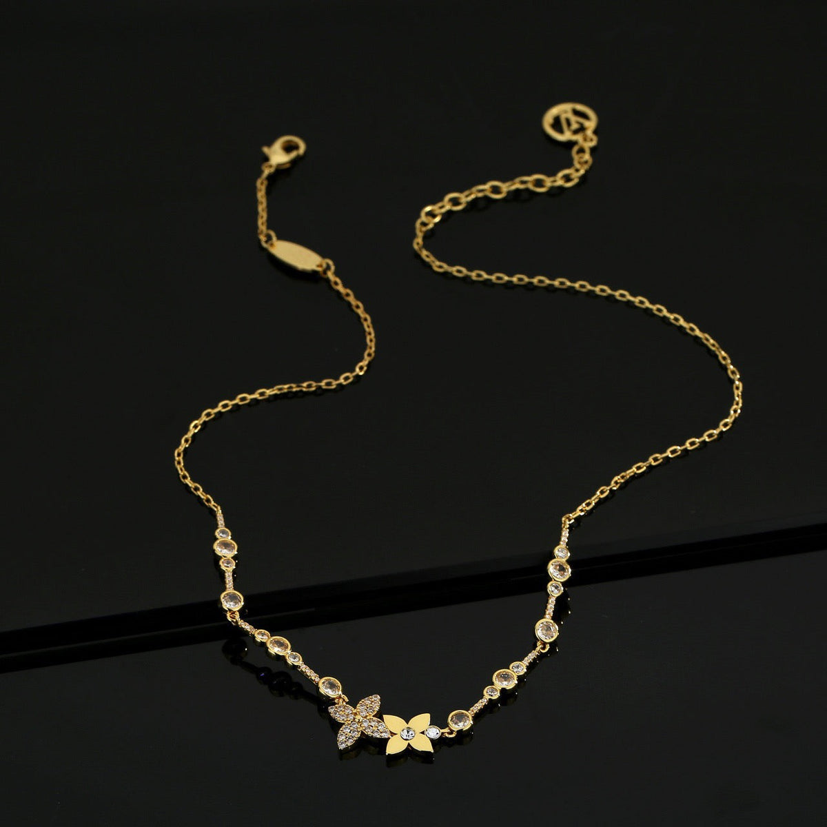 Martin Graham pendant necklace in polished metal-tone – side detail