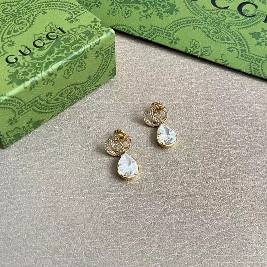 Martin Graham stud earrings in polished metal-tone – side detail