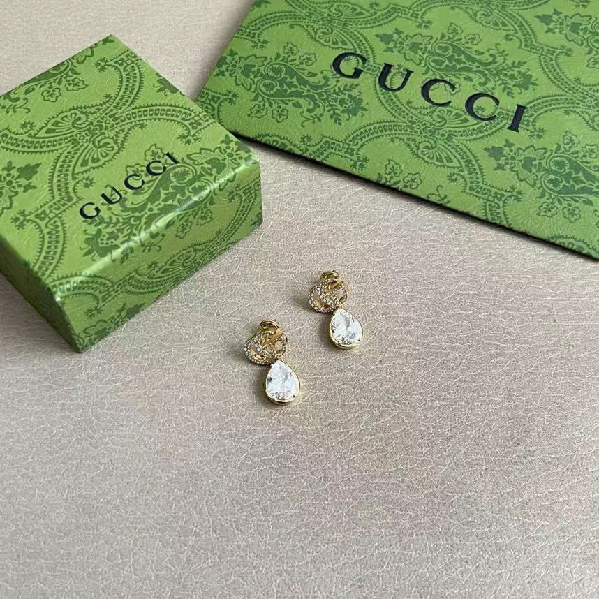 Martin Graham stud earrings in polished metal-tone – styled product view