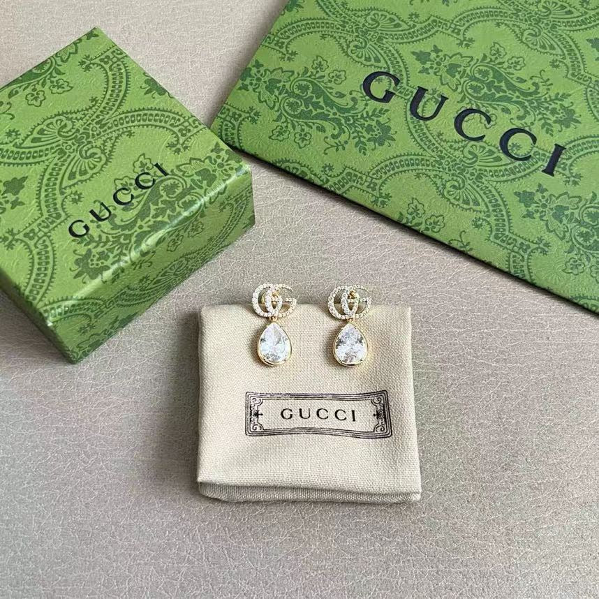 Martin Graham stud earrings in polished metal-tone – front product view