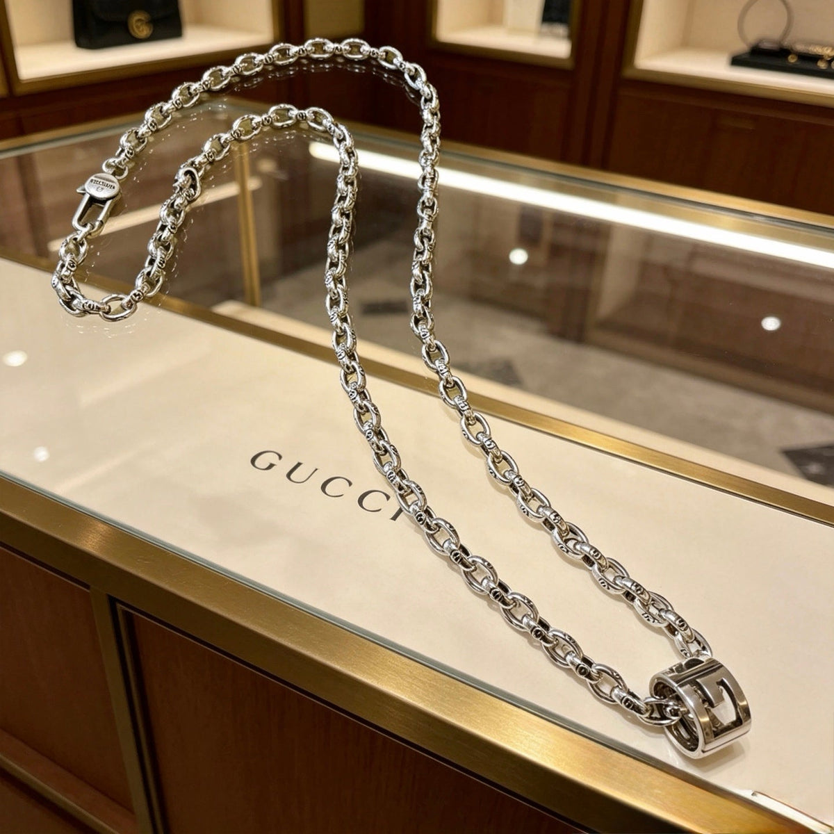 Martin Graham pendant necklace in polished metal-tone – front product view