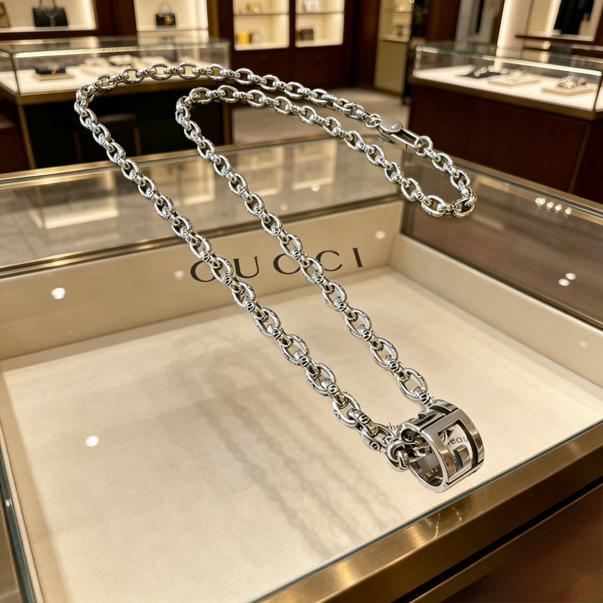 Martin Graham pendant necklace in polished metal-tone – front product view