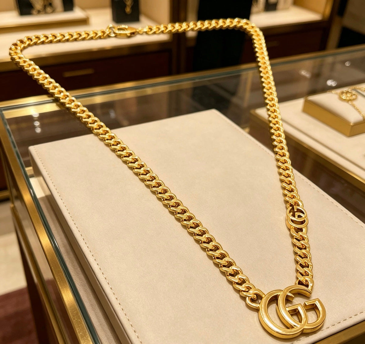 Martin Graham pendant necklace in polished metal-tone – close-up detail