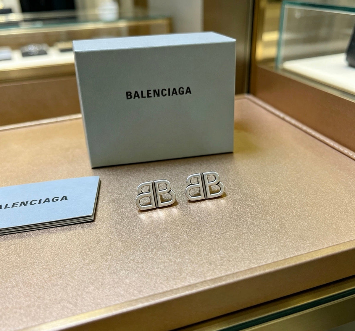 Martin Graham stud earrings in polished metal-tone – front product view