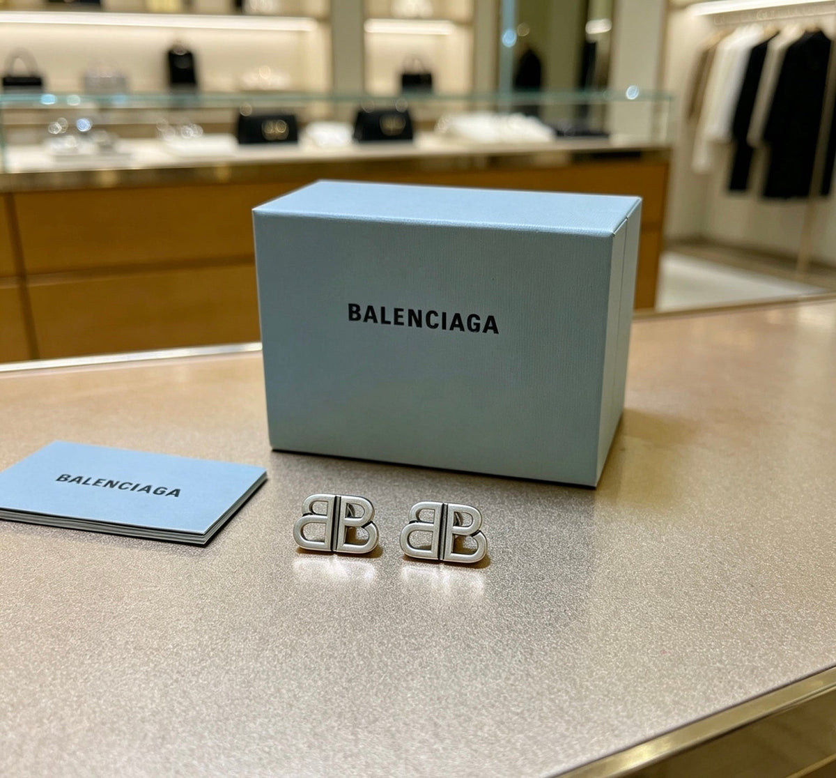 Martin Graham stud earrings in polished metal-tone – side detail