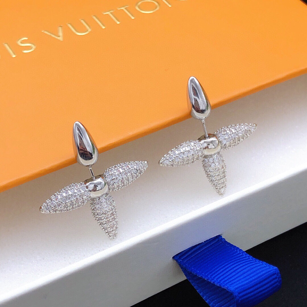 Martin Graham stud earrings in polished metal-tone – detail view
