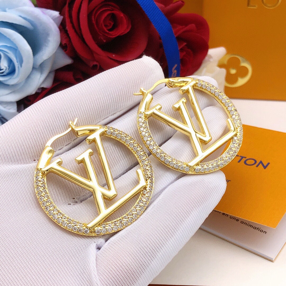 Martin Graham earrings in polished metal-tone – front product view