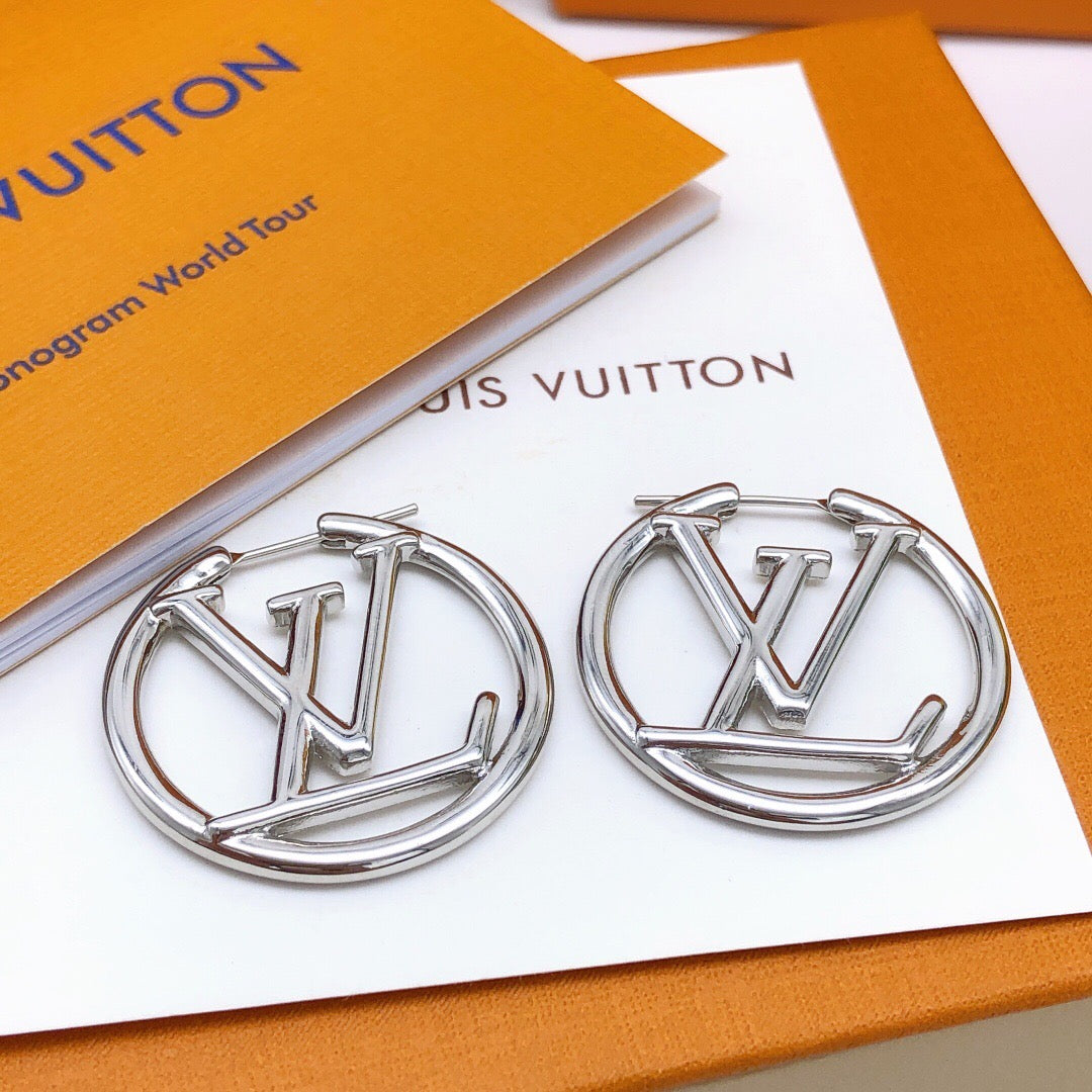 Martin Graham earrings in polished metal-tone – close-up detail