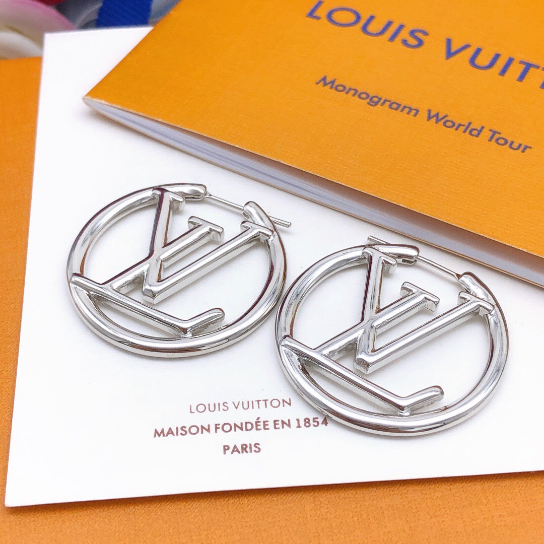 Martin Graham earrings in polished metal-tone – front product view