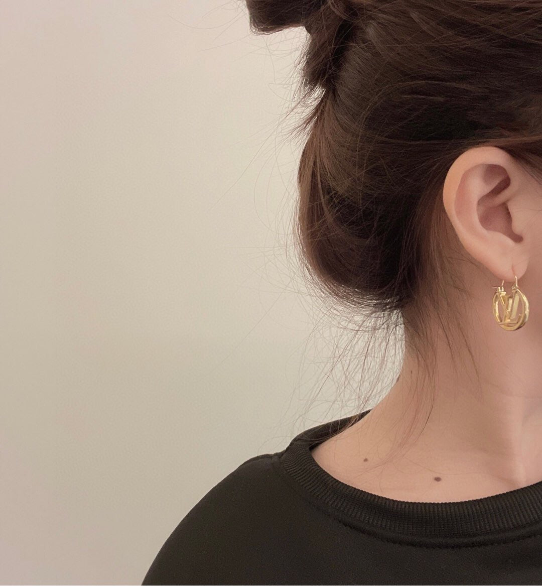 Martin Graham earrings in polished metal-tone – front product view