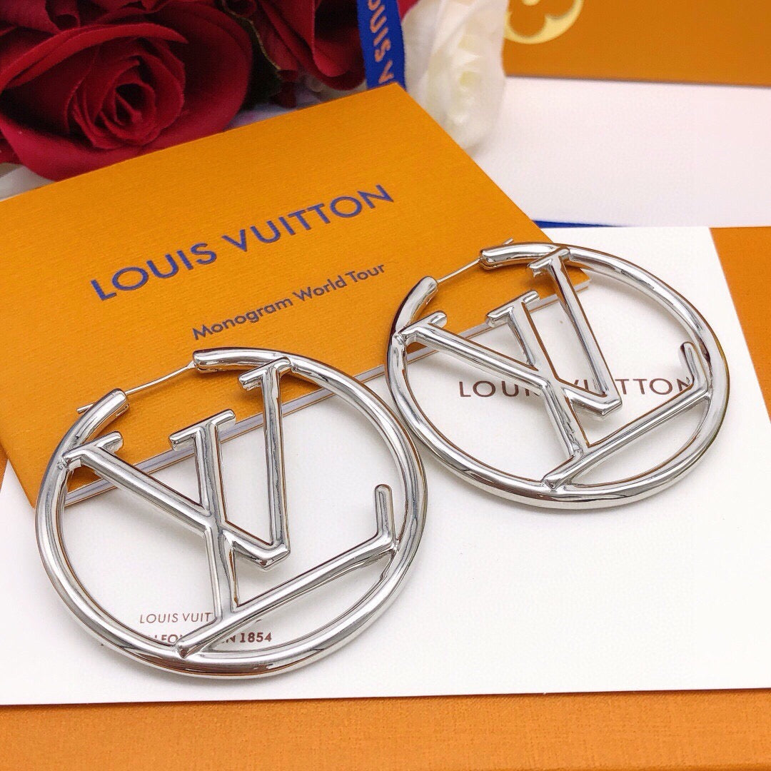 Martin Graham earrings in polished metal-tone – close-up detail