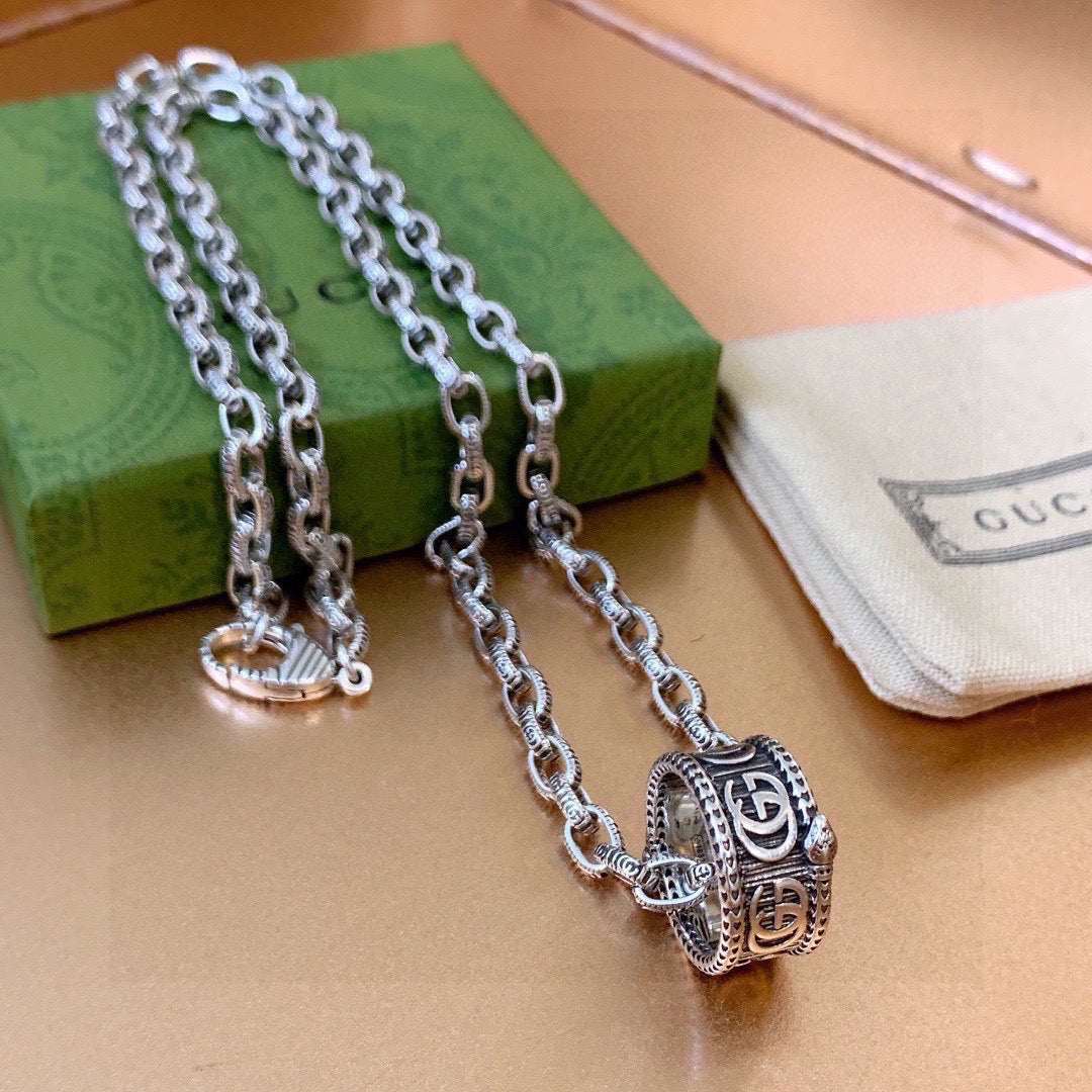 Martin Graham pendant necklace in polished metal-tone – front product view