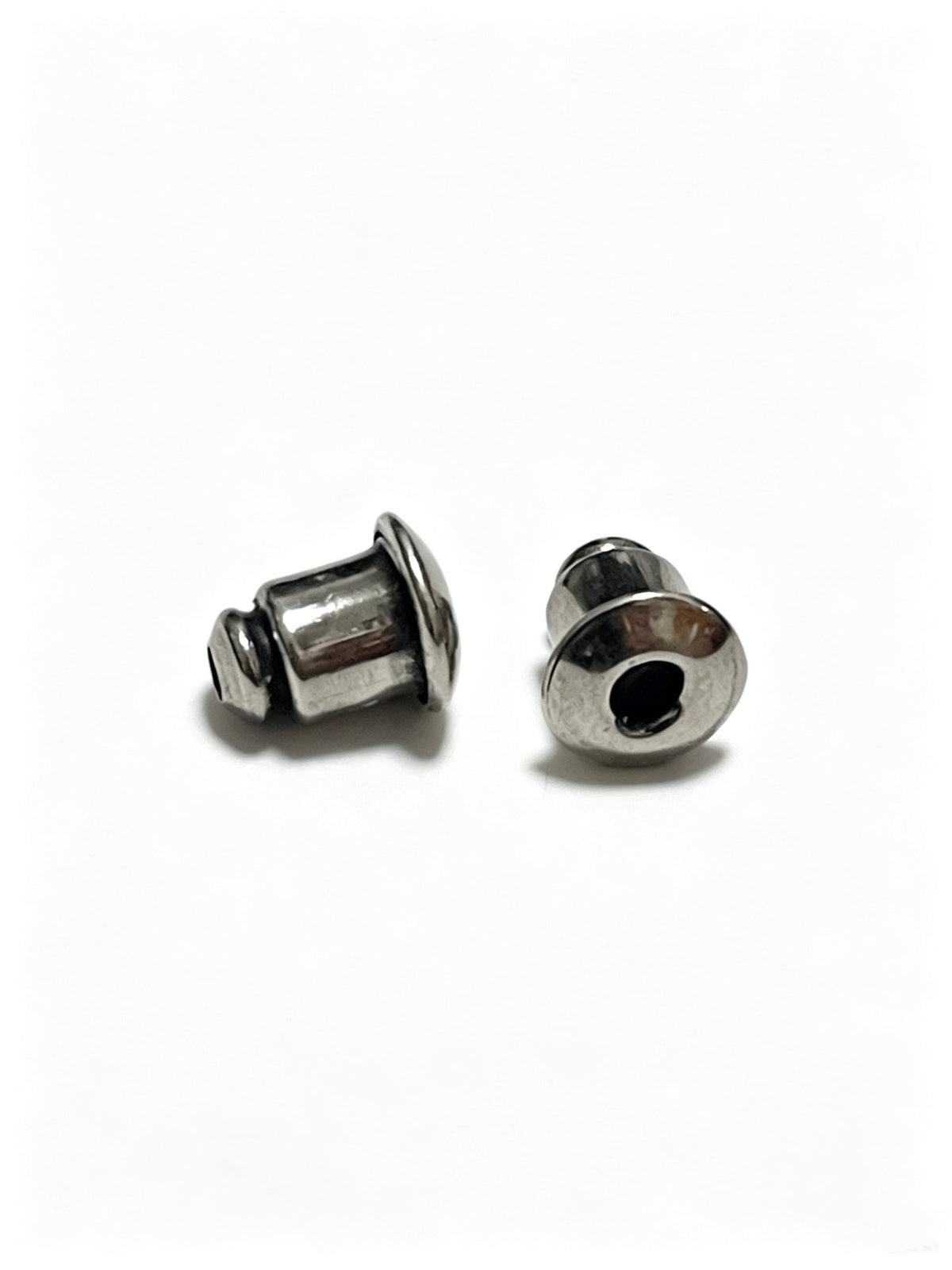 Martin Graham earrings in polished metal-tone – close-up detail