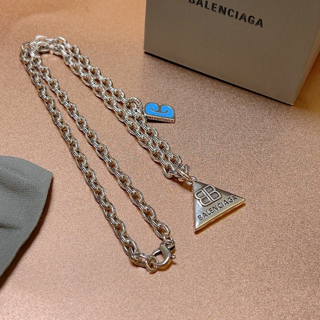 Martin Graham pendant necklace in polished metal-tone – side detail