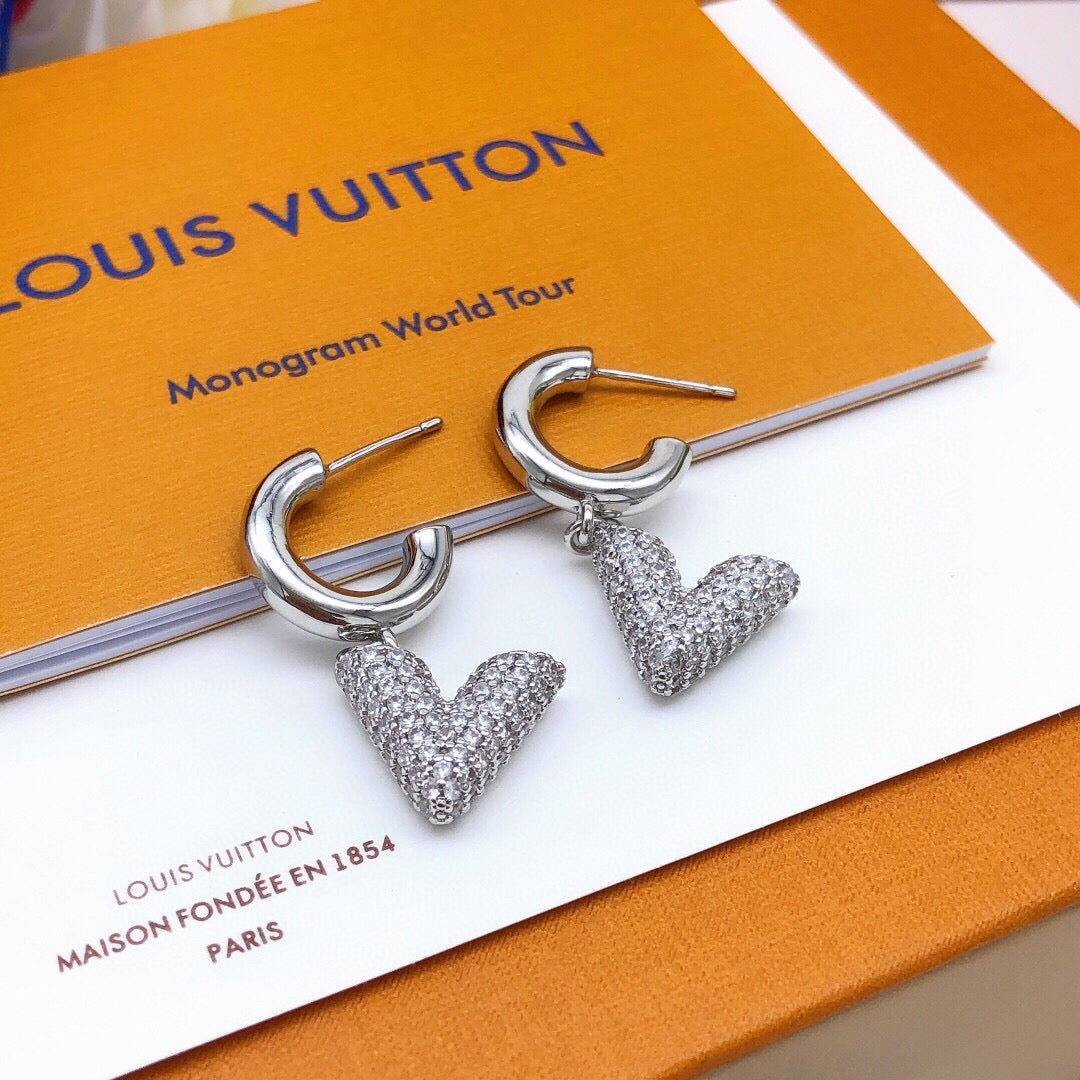 Martin Graham earrings in polished metal-tone – close-up detail