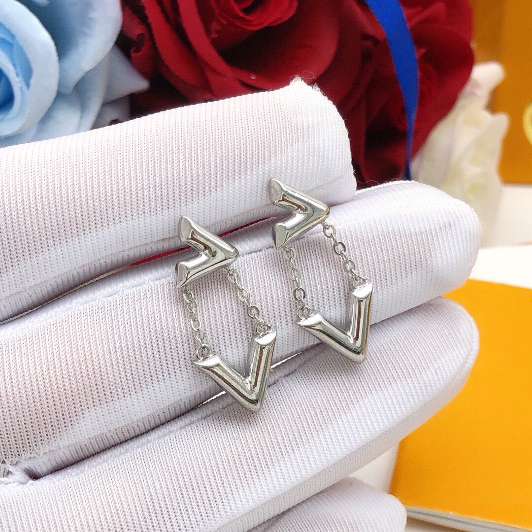 Martin Graham stud earrings in polished metal-tone – side detail