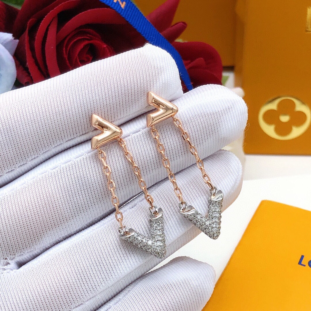 Martin Graham stud earrings in polished metal-tone – close-up detail